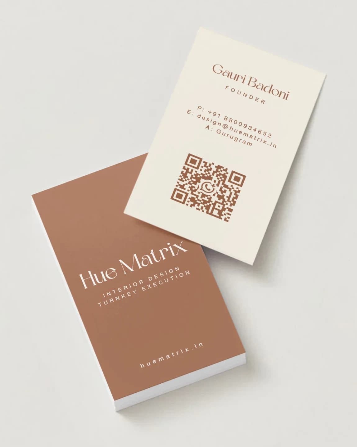 Terracotta and cream business cards designed for Hue Matrix, an interior design and turnkey execution studio